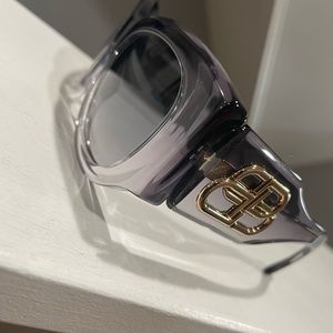 Grey Balenciaga sunglasses. Never worn! Comes with case and cleaning cloth.